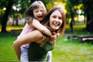 Woman Carrying a Special care needed child